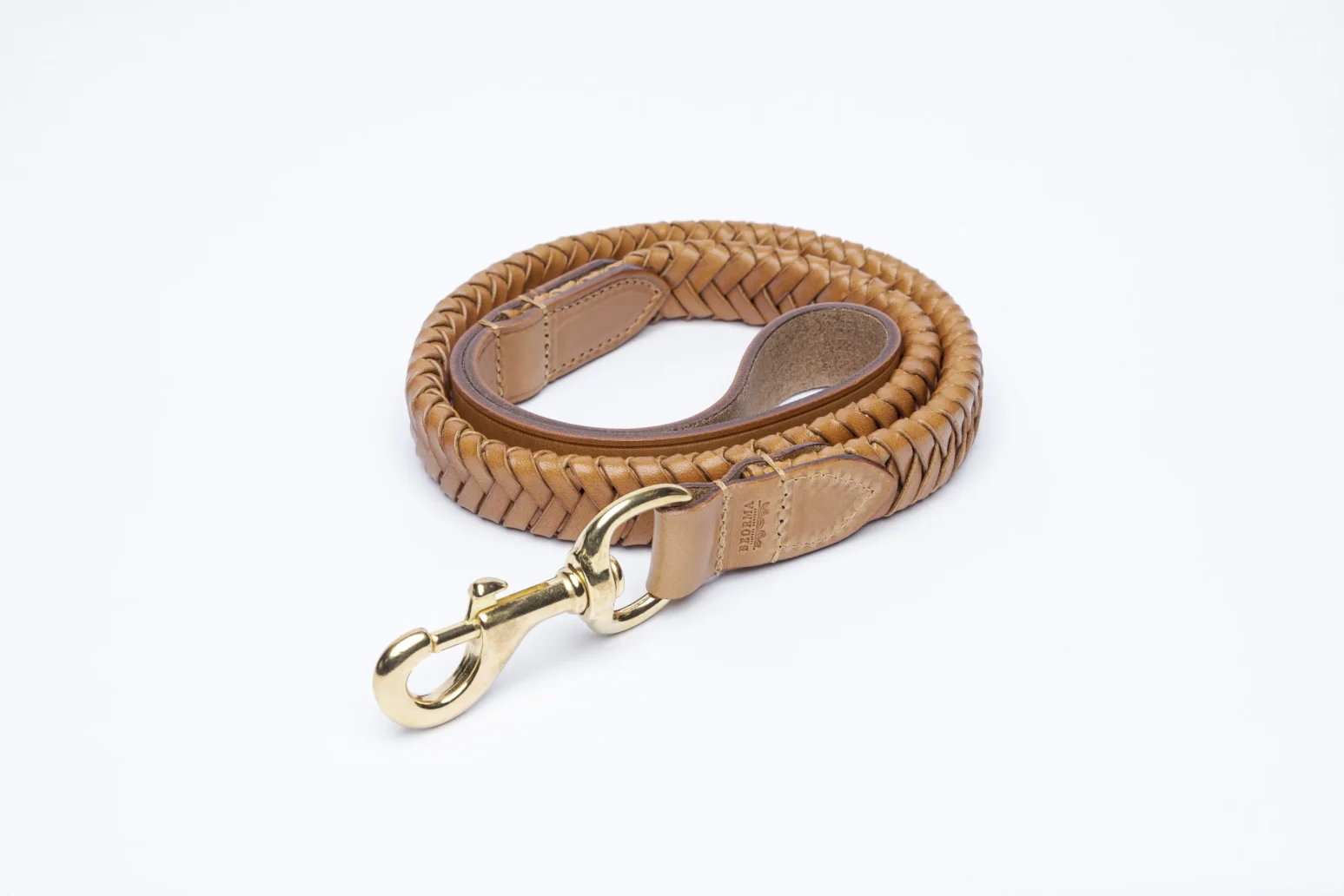 Plaited Dog Lead in Vegetable Tan Leather in Tan coiled