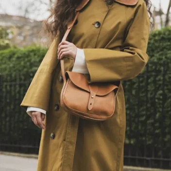A female model is wearing The Radcliffe Shoulder Bag