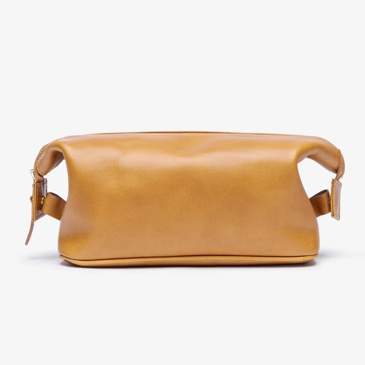 The Leighton Wash Bag in Red Rum Tan side view